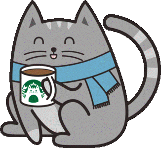 a kitty drinking hot cocoa